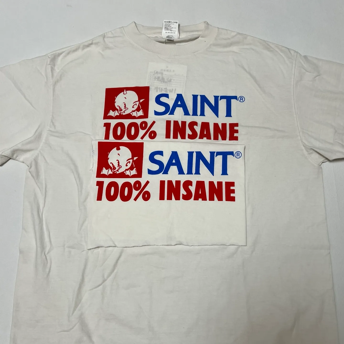 Printing proofing comparison SAINT Mxxxxxx INSANE SS TEE/WHT Little Devil Angel TEE 100% INSANE slogan printed short sleeves Off-white S-XL Tube weaving without side seam fabric OE yarn Original same weight Correct version Original main mark/wash mark/little angel security code Original development No touch printing
